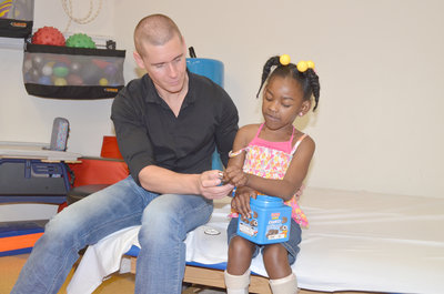Linc Hand chats with Xandria Shanklin of Jasper during a visti at Children’s on 3rd Outpatient Center in Birmingham. Daily Mountain Eagle - James Phillips